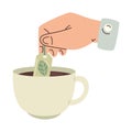 Hand holding tea bag hot drink Royalty Free Stock Photo