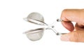 Hand holding tea strainer