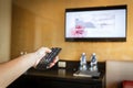 Hand holding Television remote control Royalty Free Stock Photo