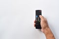 Hand holding television remote control Royalty Free Stock Photo