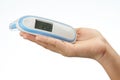 Hand holding tempreture thermometer Royalty Free Stock Photo