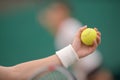 hand holding tennis ball Royalty Free Stock Photo