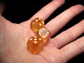 Hand holding three dice on a black background Royalty Free Stock Photo