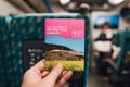 Hand holding a ticket of Taiwan High Speed Train on platform in Taiwan, Taipei