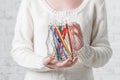 Hand holding a tin with color pencils Royalty Free Stock Photo