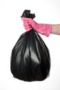 Hand holding trash bag