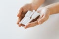 Hand holding tubes of micro enema Royalty Free Stock Photo