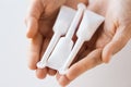 Hand holding tubes of micro enema Royalty Free Stock Photo