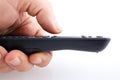 Hand holding TV remote control Royalty Free Stock Photo