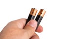 Hand holding two batteries Royalty Free Stock Photo