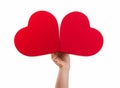 Hand holding two red hearts Royalty Free Stock Photo