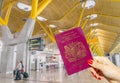 Hand holding a UK passport just before boarding Royalty Free Stock Photo