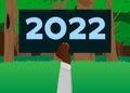 Hand holding up a banner with 2022. Future business career, New Year goals, goal concept Royalty Free Stock Photo