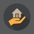 Hand holding up house flat icon. Round colorful button, circular vector sign with long shadow effect. Royalty Free Stock Photo