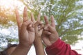 Hand holding up the peace sign