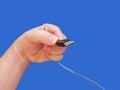 Hand holding USB cable 1-Blue Background Royalty Free Stock Photo