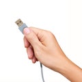 Hand holding USB cable isolated on white Royalty Free Stock Photo