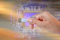 Hand holding USB data storage against bright light and circuit Royalty Free Stock Photo