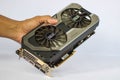 A hand holding a used Palit GeForce GTX 1070 Dual showing the front side of the Graphics Card Unit