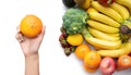 A hand holding variety of colorful fresh fruits and vegetables. Raw organic healthy food. Shopping in grocery store and Royalty Free Stock Photo