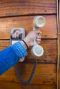 Hand holding a white vintage telephone Royalty Free Stock Photo