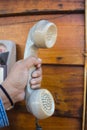 Hand holding vintage telephone receiver,Thailand Royalty Free Stock Photo