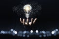 Hand holding the virtual light bulb with brain. Creative new business idea concept Royalty Free Stock Photo