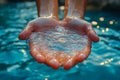 Hand is holding water in a pool Royalty Free Stock Photo