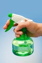 Hand holding water sprayer Royalty Free Stock Photo