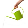 Hand holding watering can