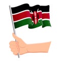 Hand holding and waving the national flag of Kenya. Fans, independence day, patriotic concept. Vector illustration