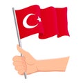 Hand holding and waving the national flag of Turkey. Fans, independence day, patriotic concept. Vector illustration