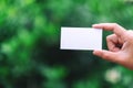 A hand holding a white blank business card Royalty Free Stock Photo