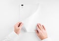 Hand holding white blank paper sheet mockup  isolated. Arm in shirt hold clear brochure template mock up. Reading contract Royalty Free Stock Photo