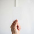 Hand holding white card, isolated on white background Royalty Free Stock Photo