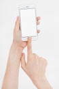 Hand holding white cellphone isolated on white clipping path inside. Online shopping. Top view. Mock up. Copy space. Template.Blan Royalty Free Stock Photo