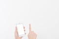 Hand holding white cellphone isolated on white clipping path inside. Online shopping. Top view. Mock up. Copy space. Template.Blan Royalty Free Stock Photo