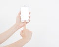 Hand holding white cellphone isolated on white clipping path inside. Online shopping. Top view. Mock up. Copy space. Template.Blan Royalty Free Stock Photo