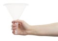 Hand holding white funnel