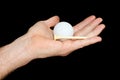 Hand Holding a White Golf Ball Royalty Free Stock Photo