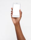 Hand holding white phone isolated on white clipping path inside. Top view.Mock up.Copy space.Template.Blank. Royalty Free Stock Photo