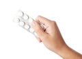 Hand holding white pills Royalty Free Stock Photo