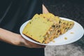 Hand holding white plate Homemade High fiber natural health food Sliced rye bread on cutting board. Whole grain rye bread with see Royalty Free Stock Photo