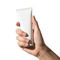 A hand holding a white rectangular object with a metallic bottom Royalty Free Stock Photo
