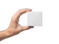 Hand holding white square object Royalty Free Stock Photo
