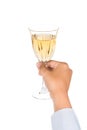 Hand holding white wine in crystal glass and ready to toast Royalty Free Stock Photo