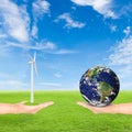 Hand holding wind turbine and earth Royalty Free Stock Photo