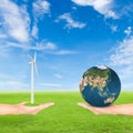 Hand holding wind turbine and earth Royalty Free Stock Photo
