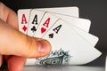 Hand holding a winning draw at a poker game. Royalty Free Stock Photo