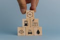 hand holding wood cube.Climate and eco friendly energy in the future for net zero emissions target.Changing CO2 to H2 fuel cell